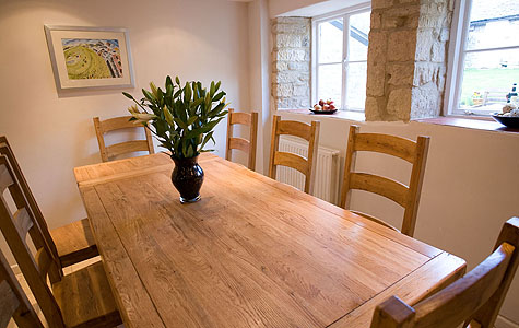 Dining room with large oak table for 8